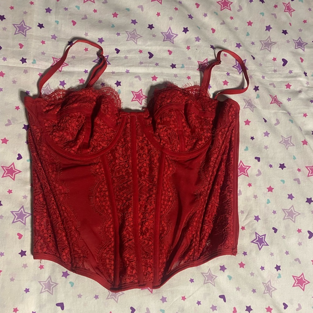 Super cute out from under red corset top